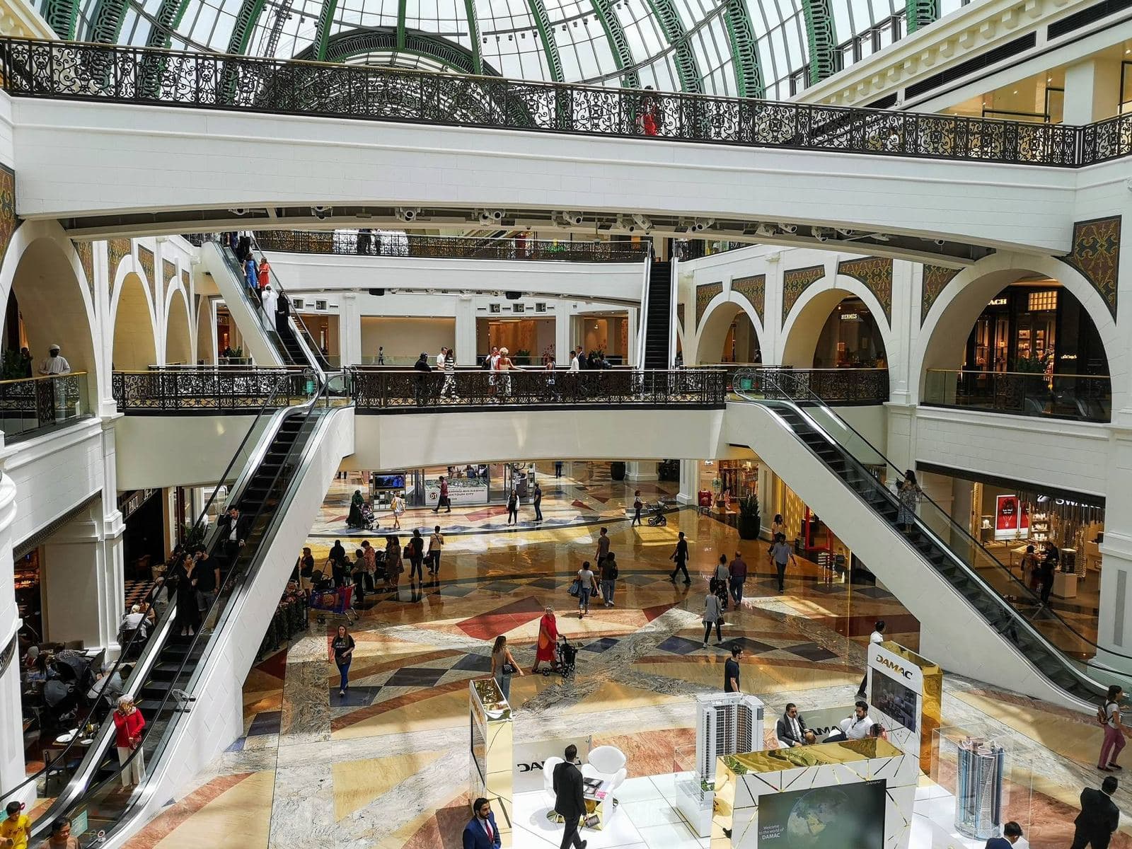 Interior of Mall of the Emirates in Al Barsha, Dubai, with its glass dome, arched galleries and escalators