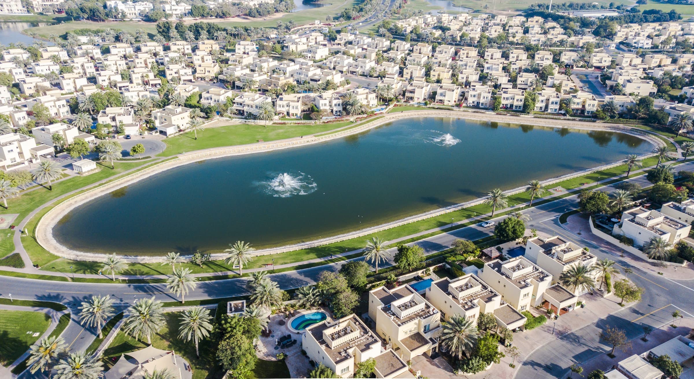 Aerial view of The Meadows, with family villas set around one of the community's lakes