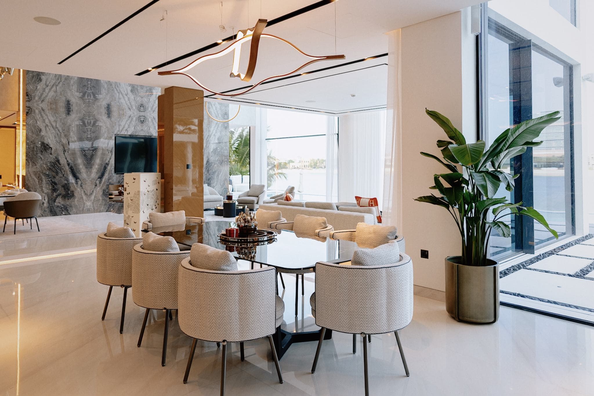 Palm Jumeirah villa dining room with designer lighting and sea views