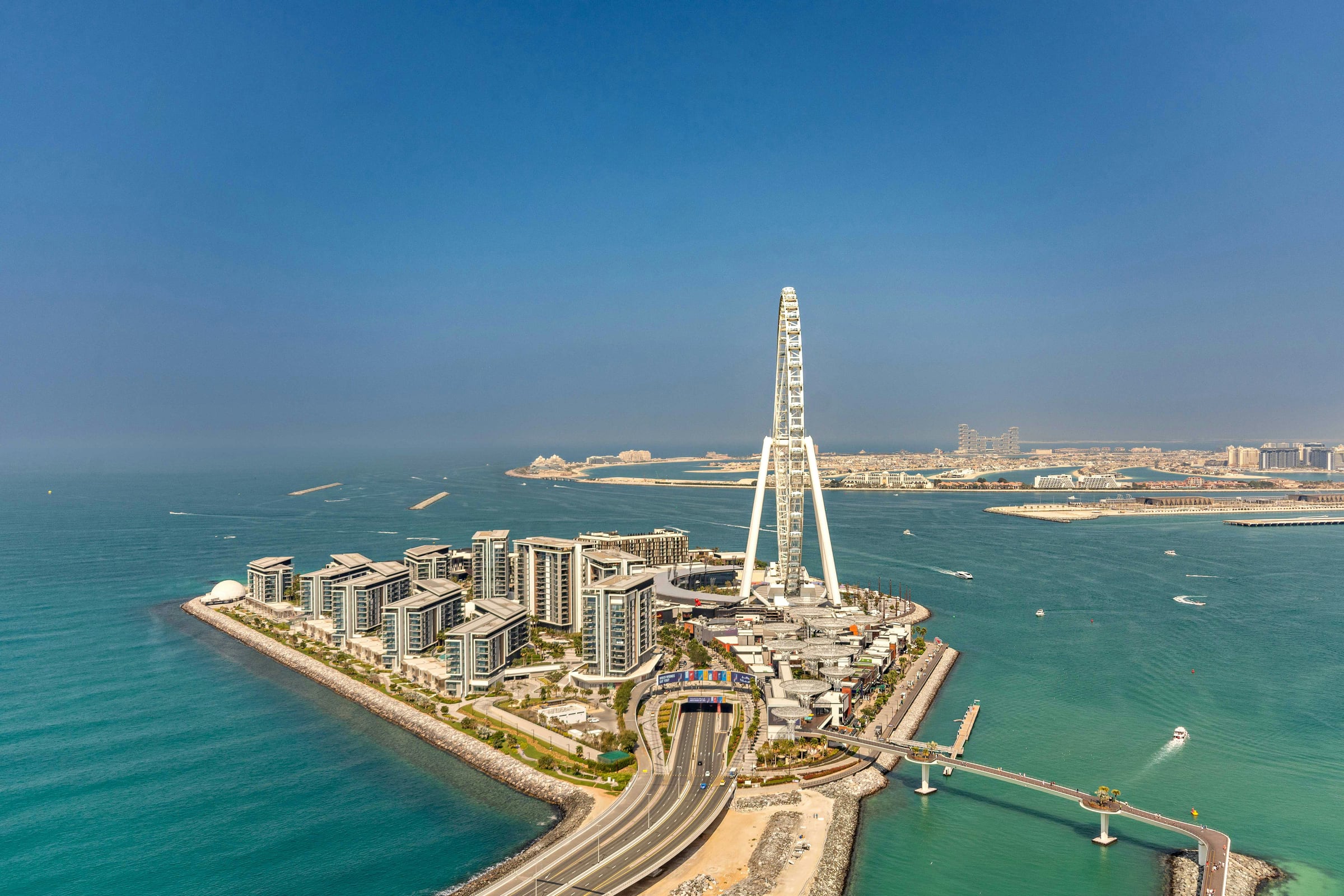 Aerial view of Bluewaters Island and Ain Dubai, linked to the JBR coast by its bridge