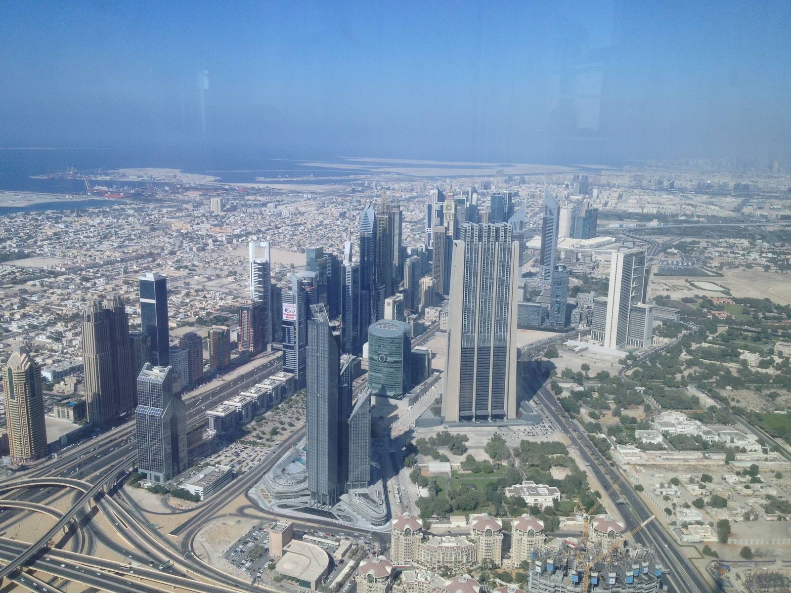 Aerial view of the DIFC skyline and Sheikh Zayed Road towers seen from the Burj Khalifa observation deck