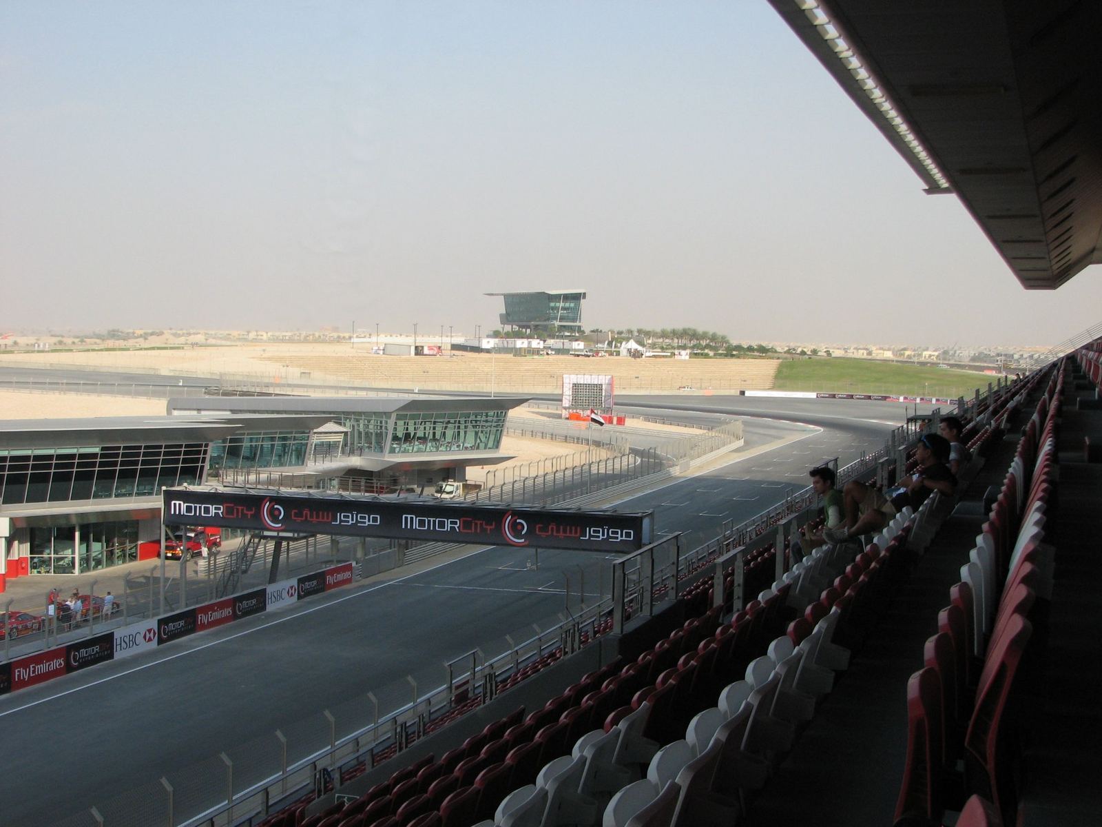 Final turn, grandstand and finish line of the Dubai Autodrome race circuit in Motor City, Dubai